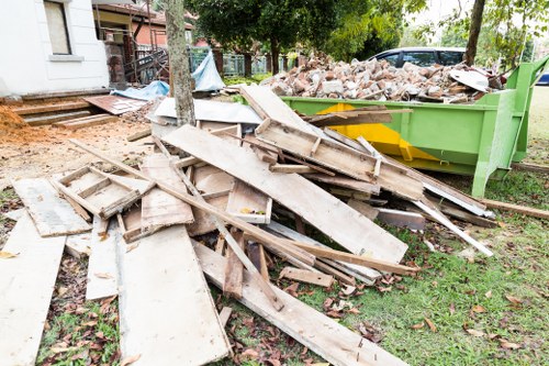 Homeowner assessing garage items for clearance in Seven Kings