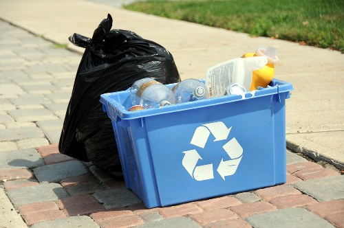 Experienced landscapers clearing garden debris